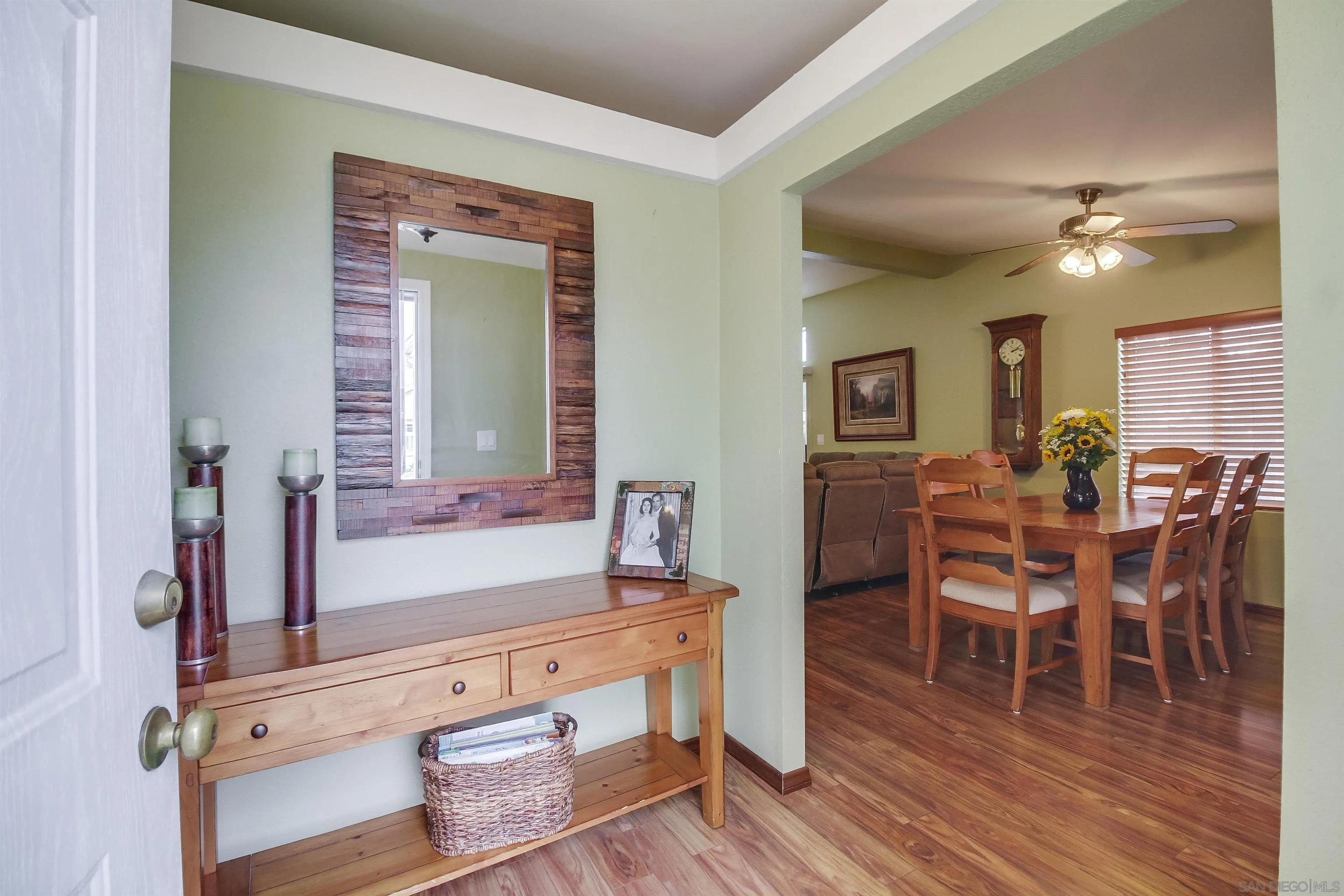 15935 Spring Oaks Road El Cajon, CA 92021 - Photo 8 of 66 a view of a dining room with furniture and wooden floor
