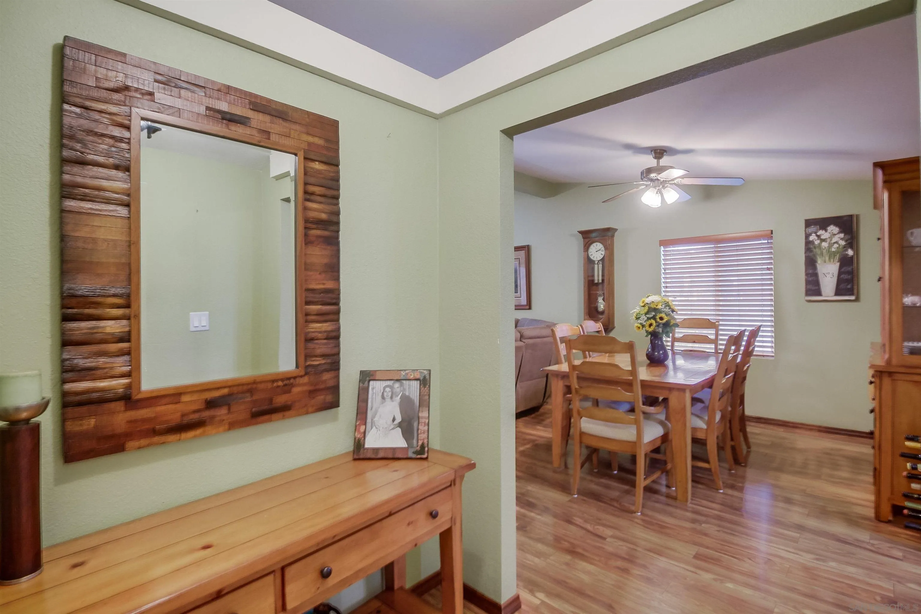 15935 Spring Oaks Road El Cajon, CA 92021 - Photo 9 of 66 a view of a dining room with furniture and wooden floor