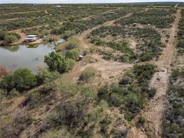 a aerial view of a house with a yard