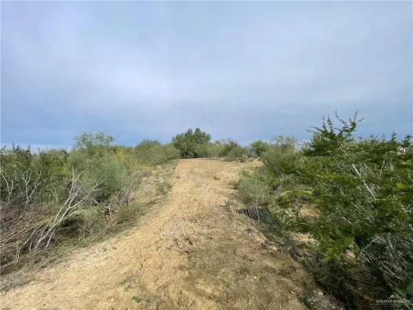 a view of lake with green space