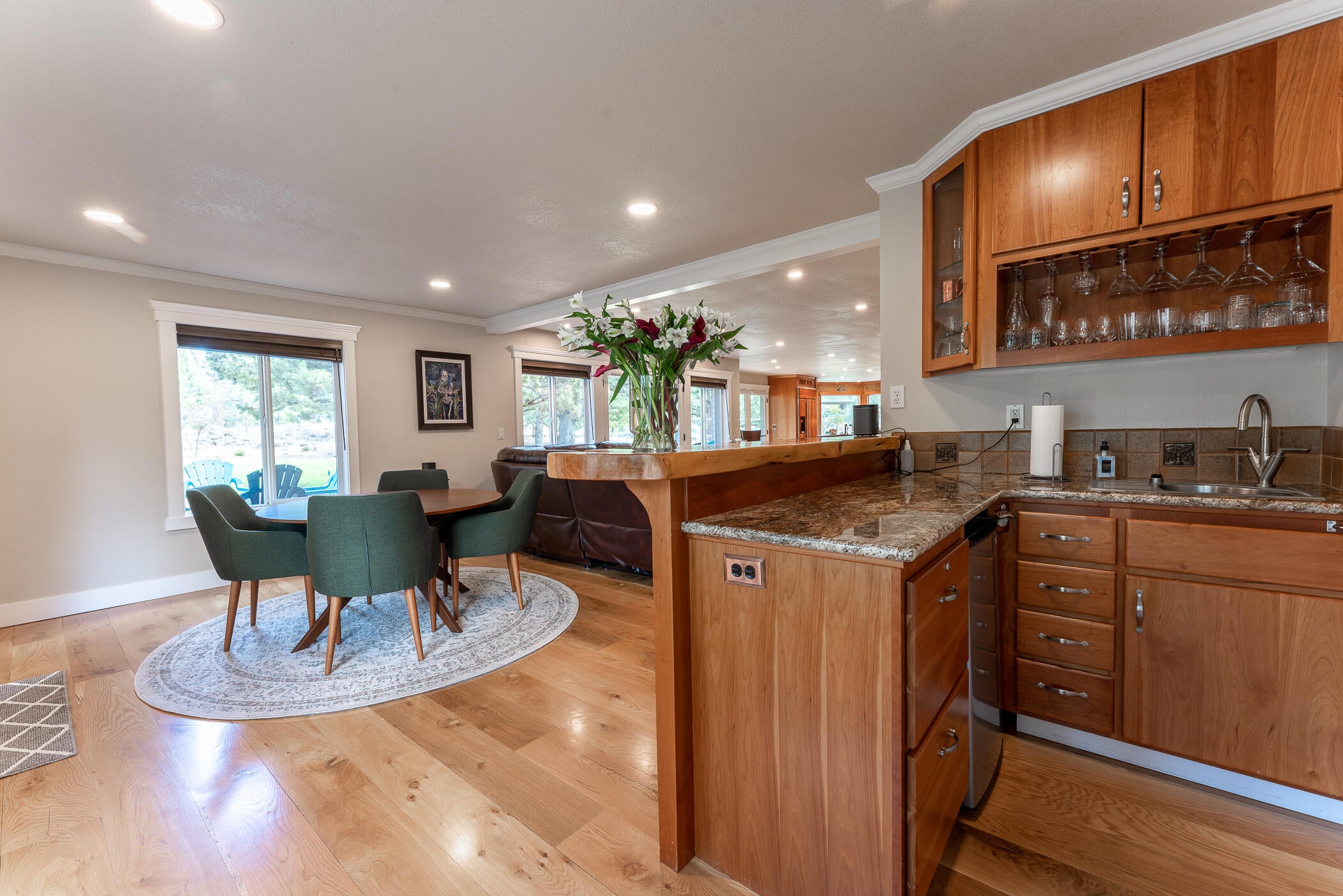 64300 Crosswinds Road Bend, OR 97703 - Photo 19 of 61 Wet bar is located at the far end of the living room and includes a prep sink and small refrigerator - perfect for entertaining and game night!