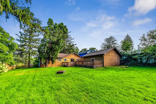 a view of a house with a yard porch and sitting area
