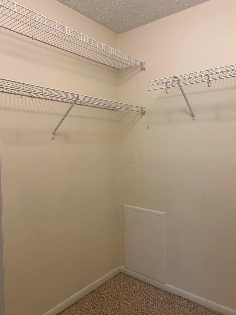 2188 Hedgerow Road, Unit 2188G Columbus, OH 43220 - Photo 15 of 26 Second bedroom closet 1