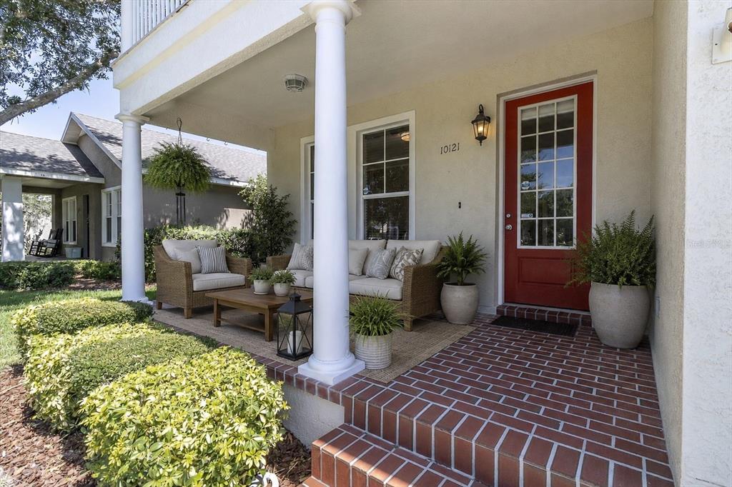 10121 Porch Street New Port Richey, FL 34655 - Photo 4 of 57 a view of a porch with chairs and potted plants
