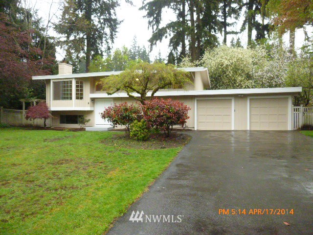 101 234th Place Southeast Bothell, WA 98021 - Photo 1 of 23 a front view of a house with garden