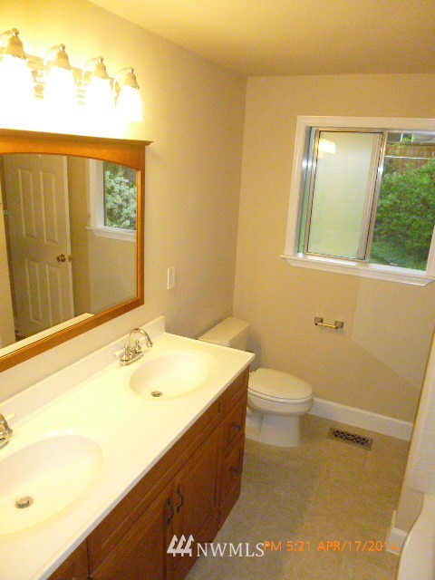 101 234th Place Southeast Bothell, WA 98021 - Photo 12 of 23 a bathroom with a sink a toilet and mirror