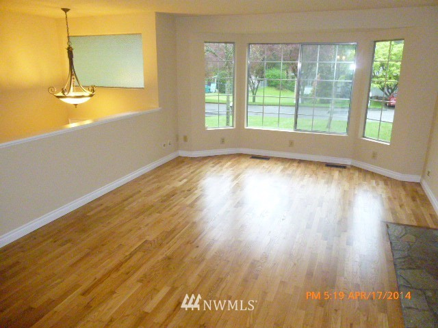 101 234th Place Southeast Bothell, WA 98021 - Photo 7 of 23 a view of an empty room and wooden floor