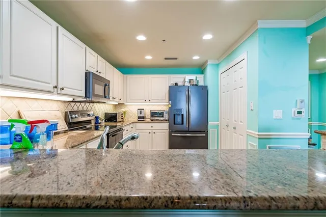 a kitchen with refrigerator and natural