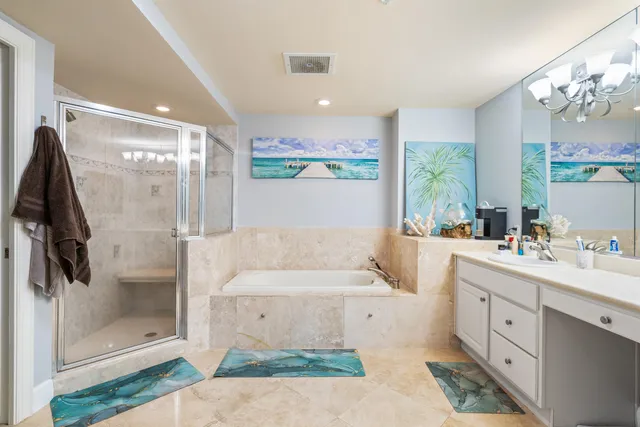 a bathroom with a double vanity sink mirror and shower