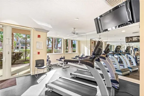 a living room with furniture and flat screen tv