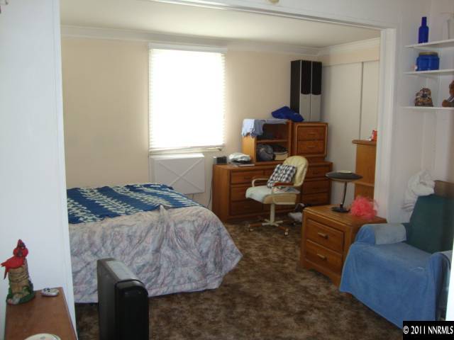 107 Burns Street Reno, NV 89502 - Photo 13 of 13 a bedroom with a bed and a couch