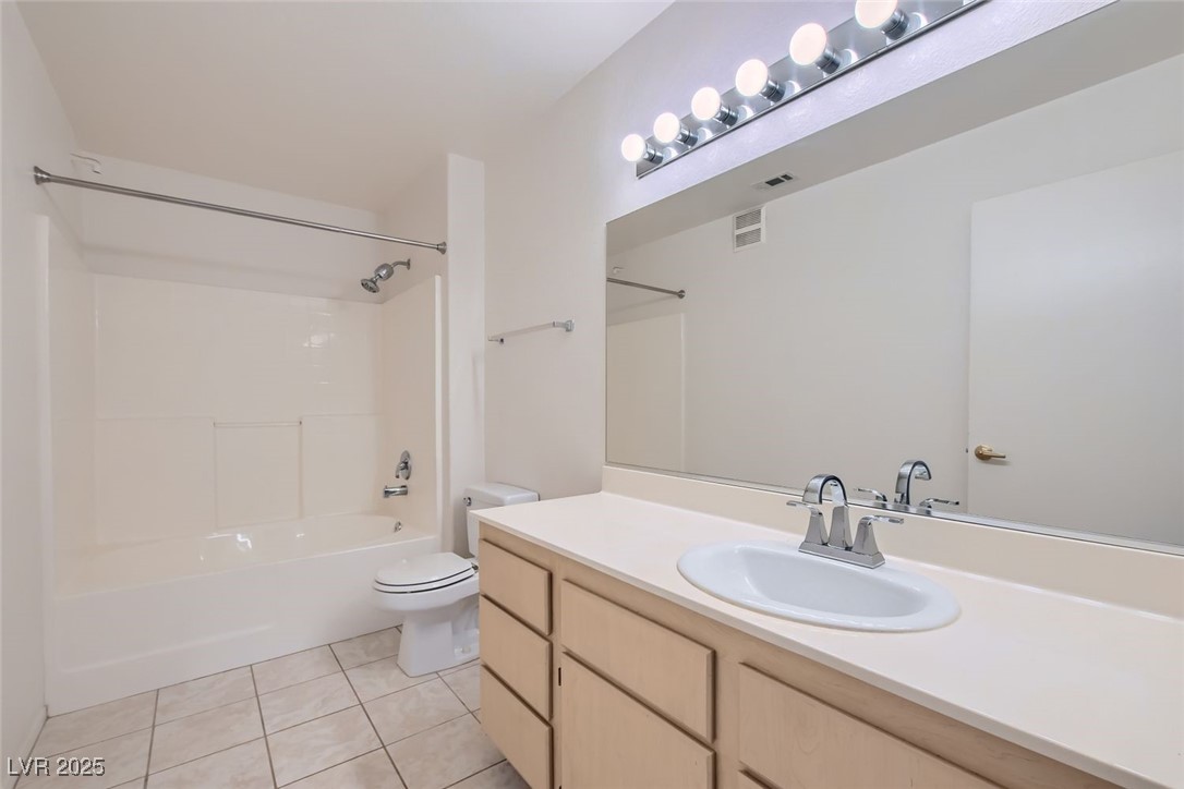 1881 West Alexander Road, Unit 1092 North Las Vegas, NV 89032 - Photo 5 of 11 Full bathroom with light tile patterned flooring, shower / bath combination, and vanity