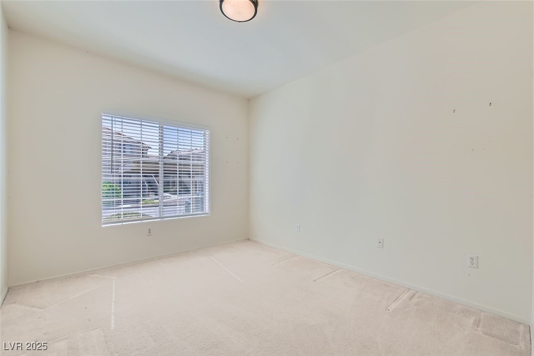 1881 West Alexander Road, Unit 1092 North Las Vegas, NV 89032 - Photo 6 of 11 Carpeted spare room with baseboards