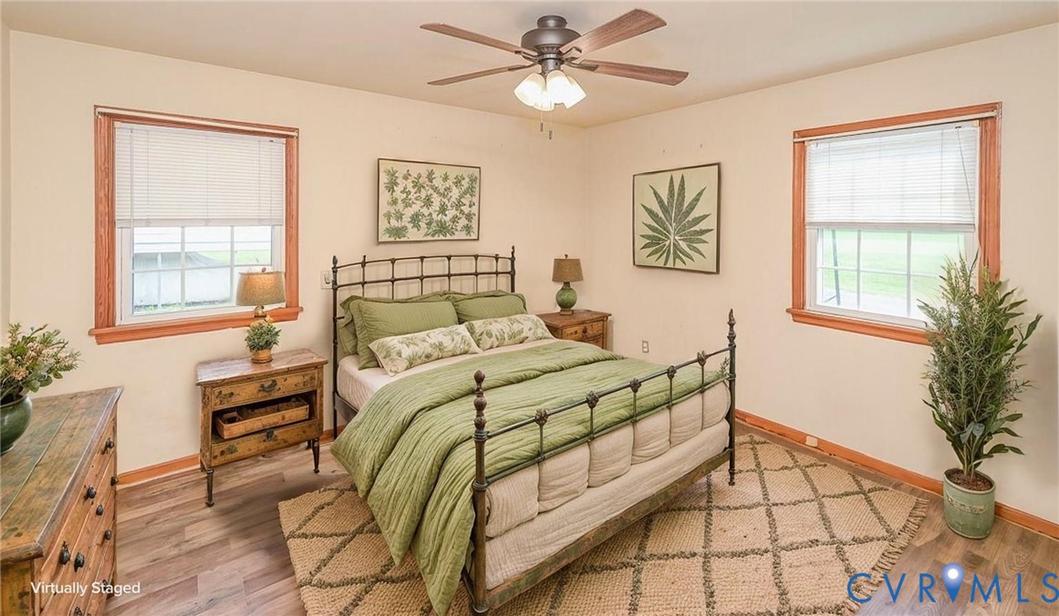 581 Smokey Road Aylett, VA 23009 - Photo 21 of 33 Wood-finish flooring with a ceiling fan, two windo