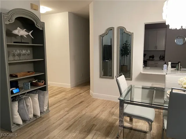 a kitchen with granite countertop a refrigerator and a stove top oven