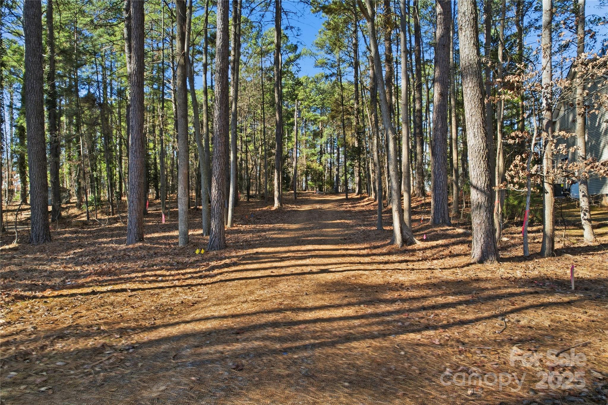2563 Brawley School Road Mooresville, NC 28117 - Photo 22 of 27 a view of a building with trees
