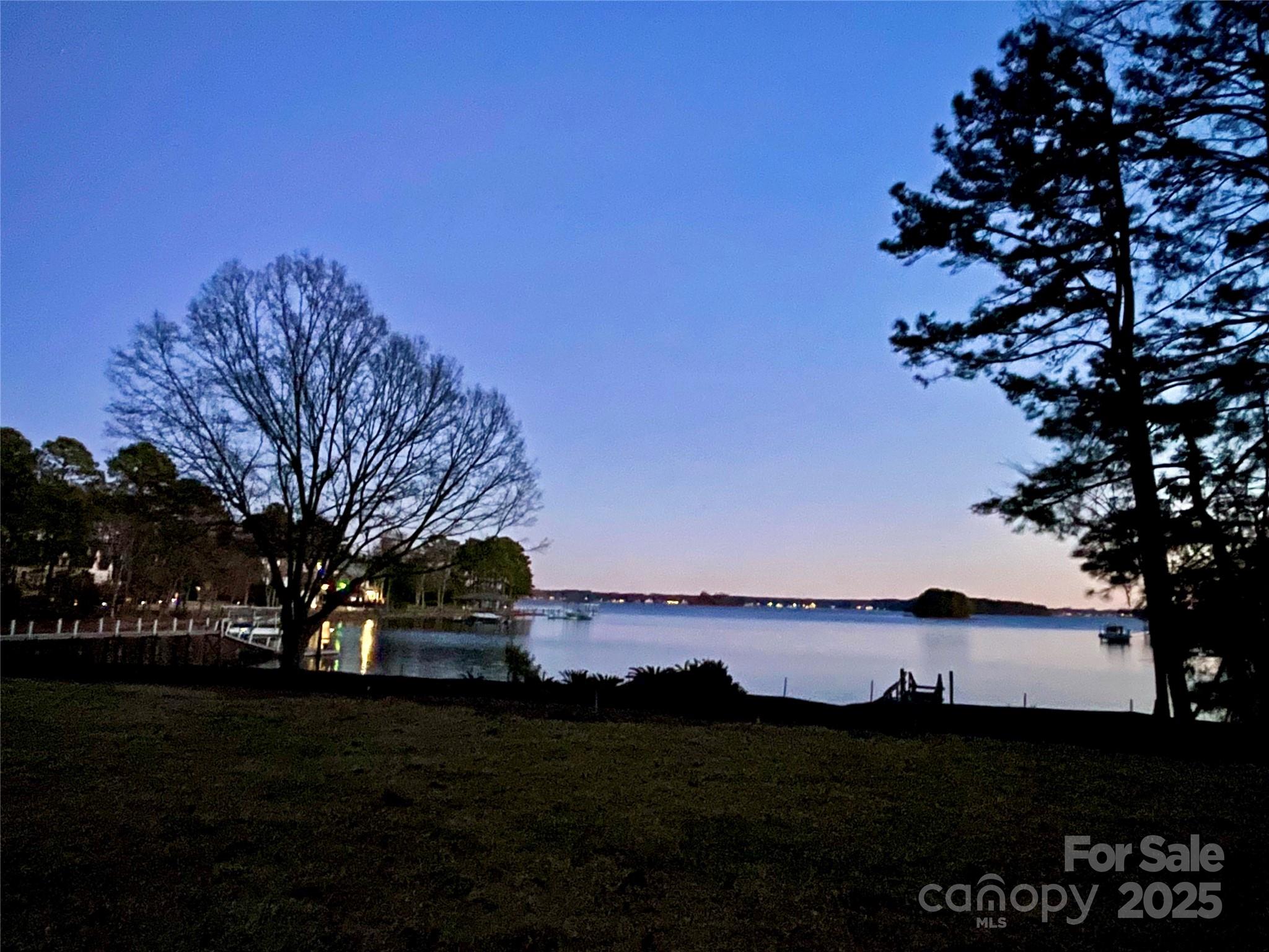 2563 Brawley School Road Mooresville, NC 28117 - Photo 25 of 27 a view of a lake with a big yard