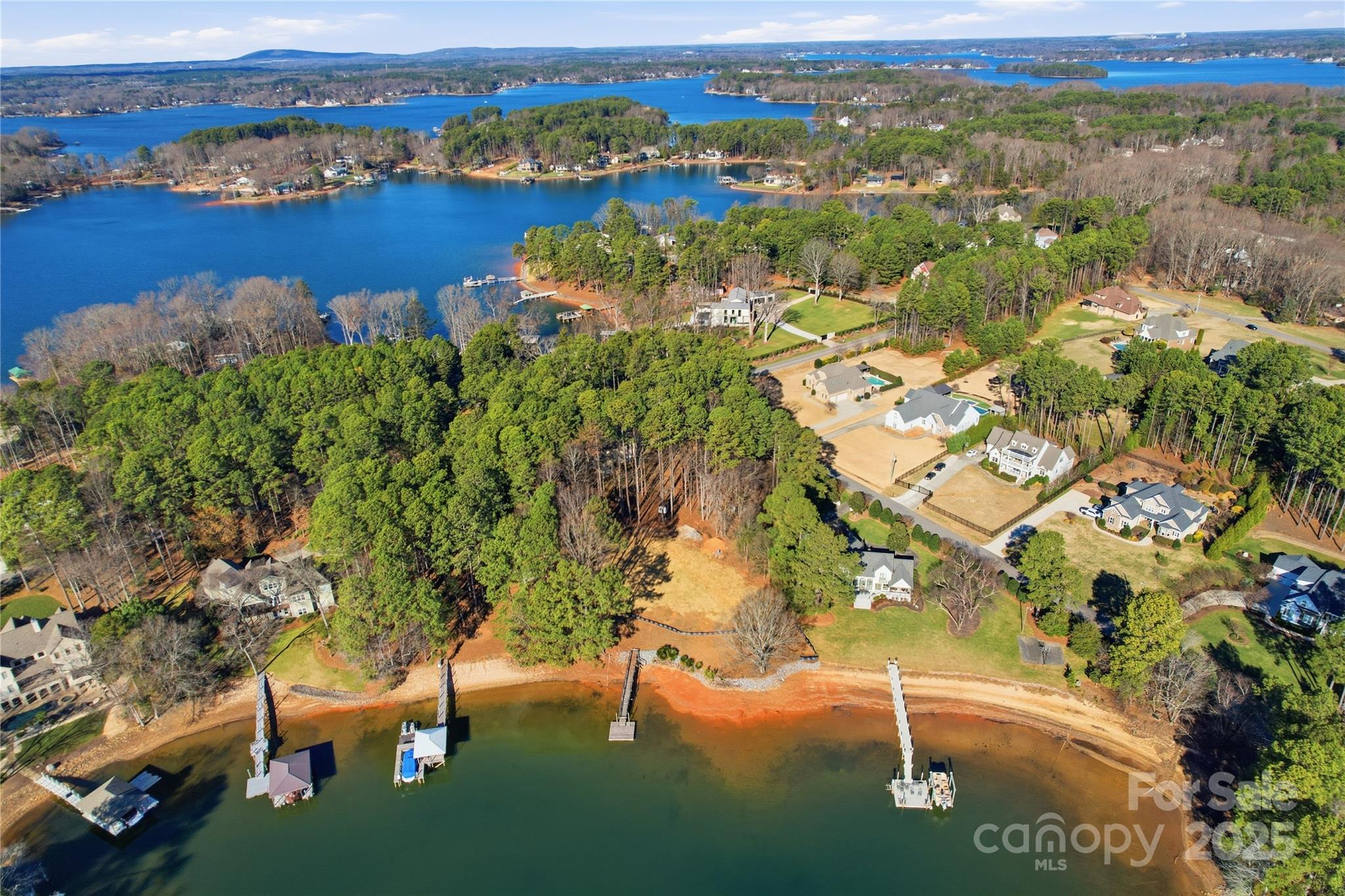 2563 Brawley School Road Mooresville, NC 28117 - Photo 9 of 27 an aerial view of residential houses with outdoor space and trees