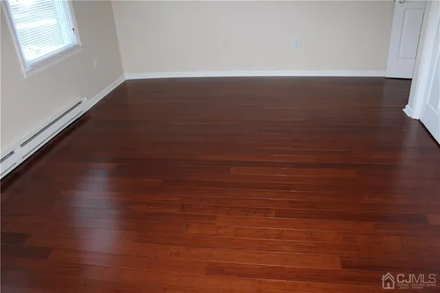 a view of room with hardwood floor