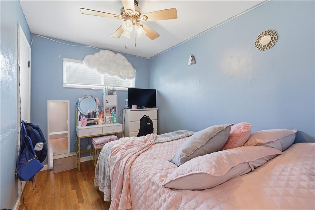 1630 Old Brodhead Road Monaca, PA 15061 - Photo 15 of 28 a bedroom with a bed and a chandelier