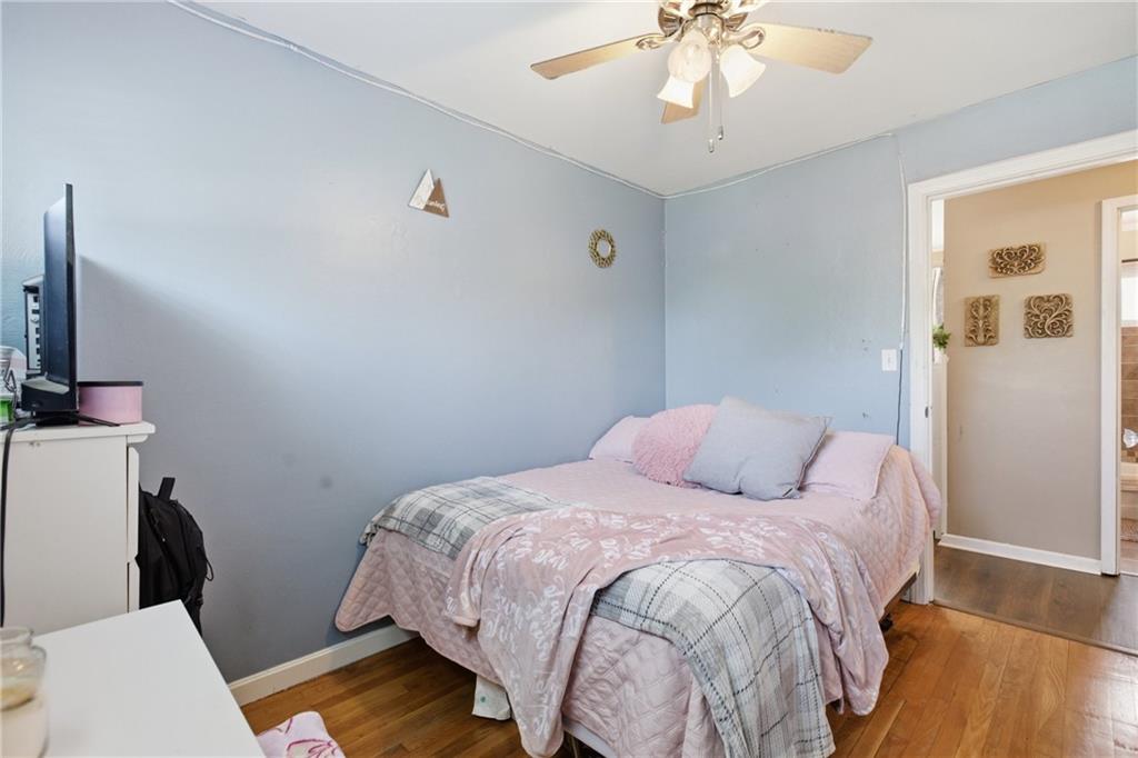 1630 Old Brodhead Road Monaca, PA 15061 - Photo 16 of 28 a bedroom with a bed and a chandelier