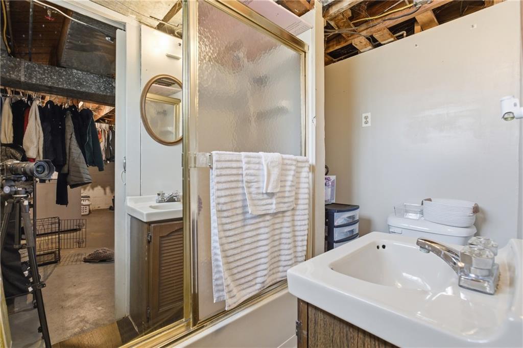 1630 Old Brodhead Road Monaca, PA 15061 - Photo 23 of 28 a bathroom with a sink a vanity and a shower