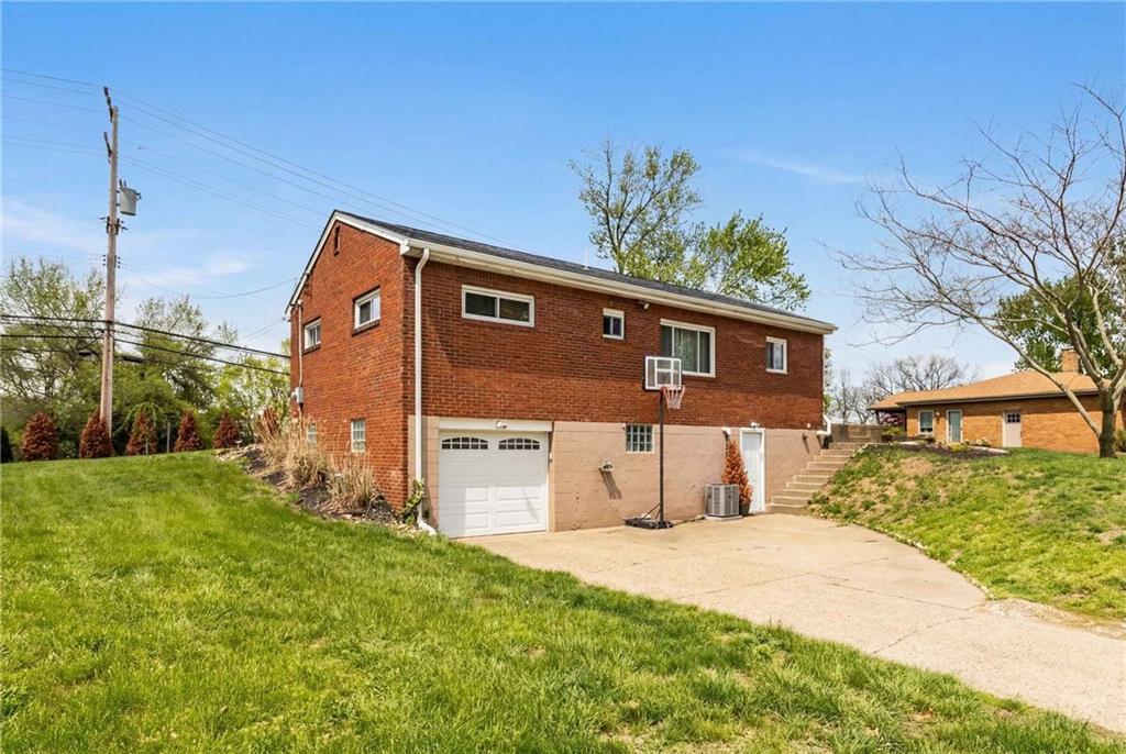 1630 Old Brodhead Road Monaca, PA 15061 - Photo 26 of 28 a front view of a house with a yard and garage
