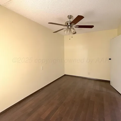a view of a big room with wooden floor