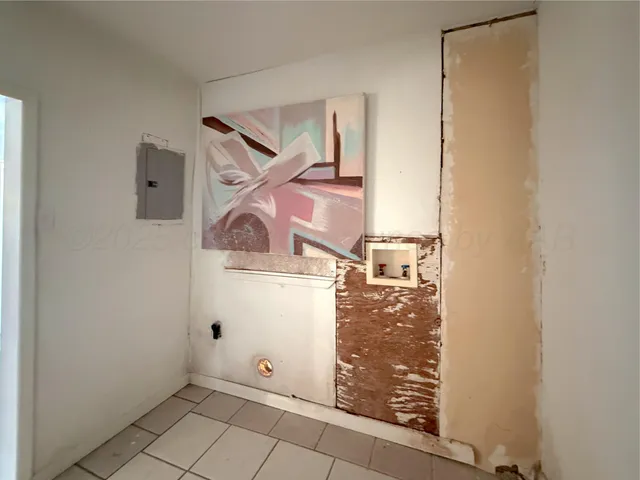 view of a room that has a door and white door