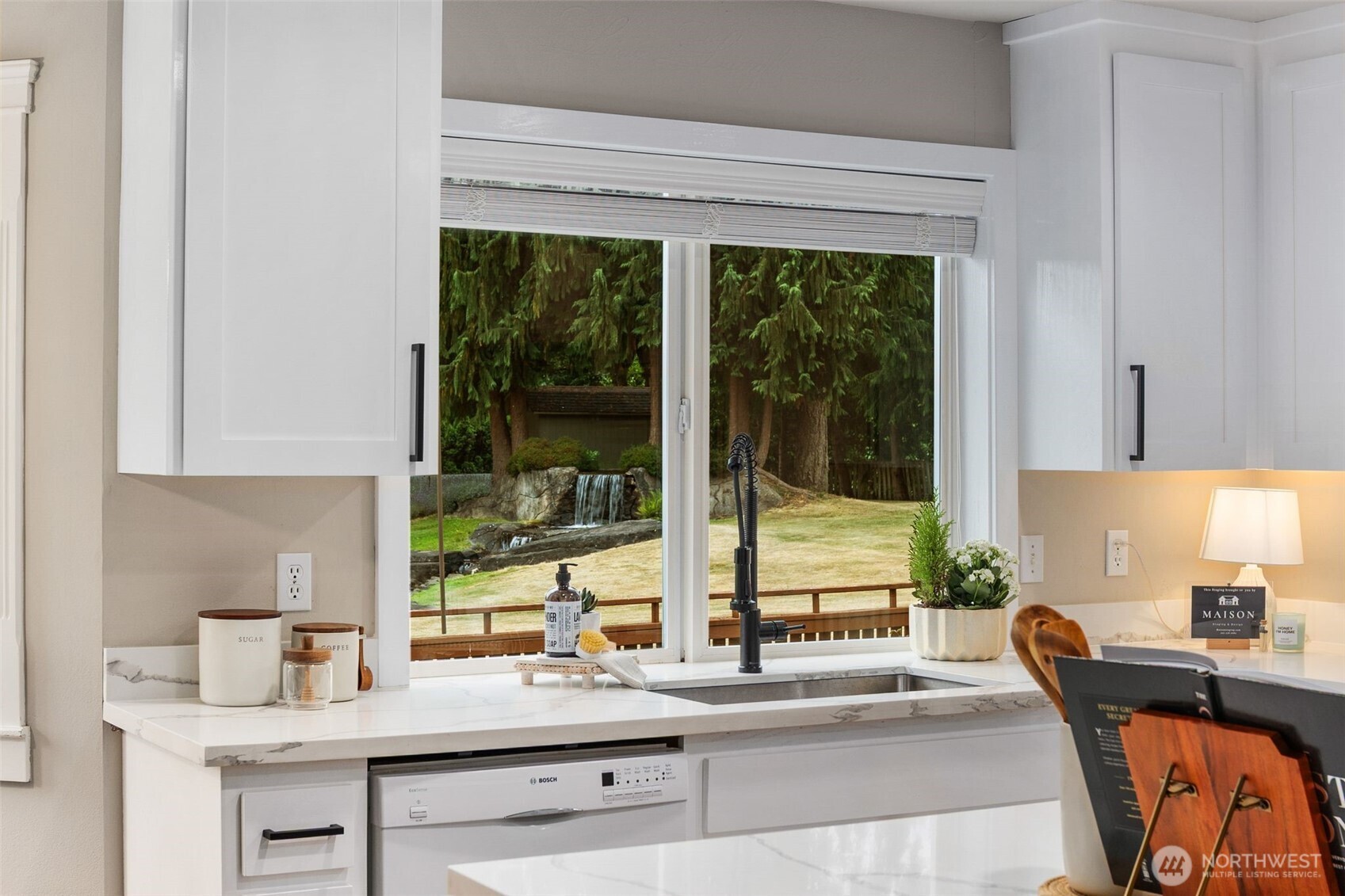 1514 232nd Place Southwest Bothell, WA 98021 - Photo 13 of 38 a kitchen with granite countertop a sink and a counter top space