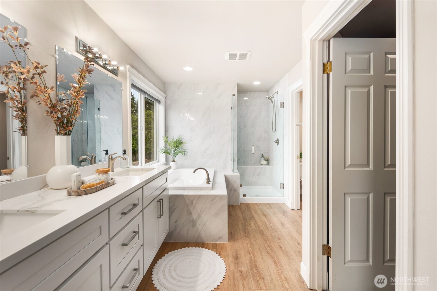 1514 232nd Place Southwest Bothell, WA 98021 - Photo 16 of 38 a spacious bathroom with a granite countertop sink mirror and a shower