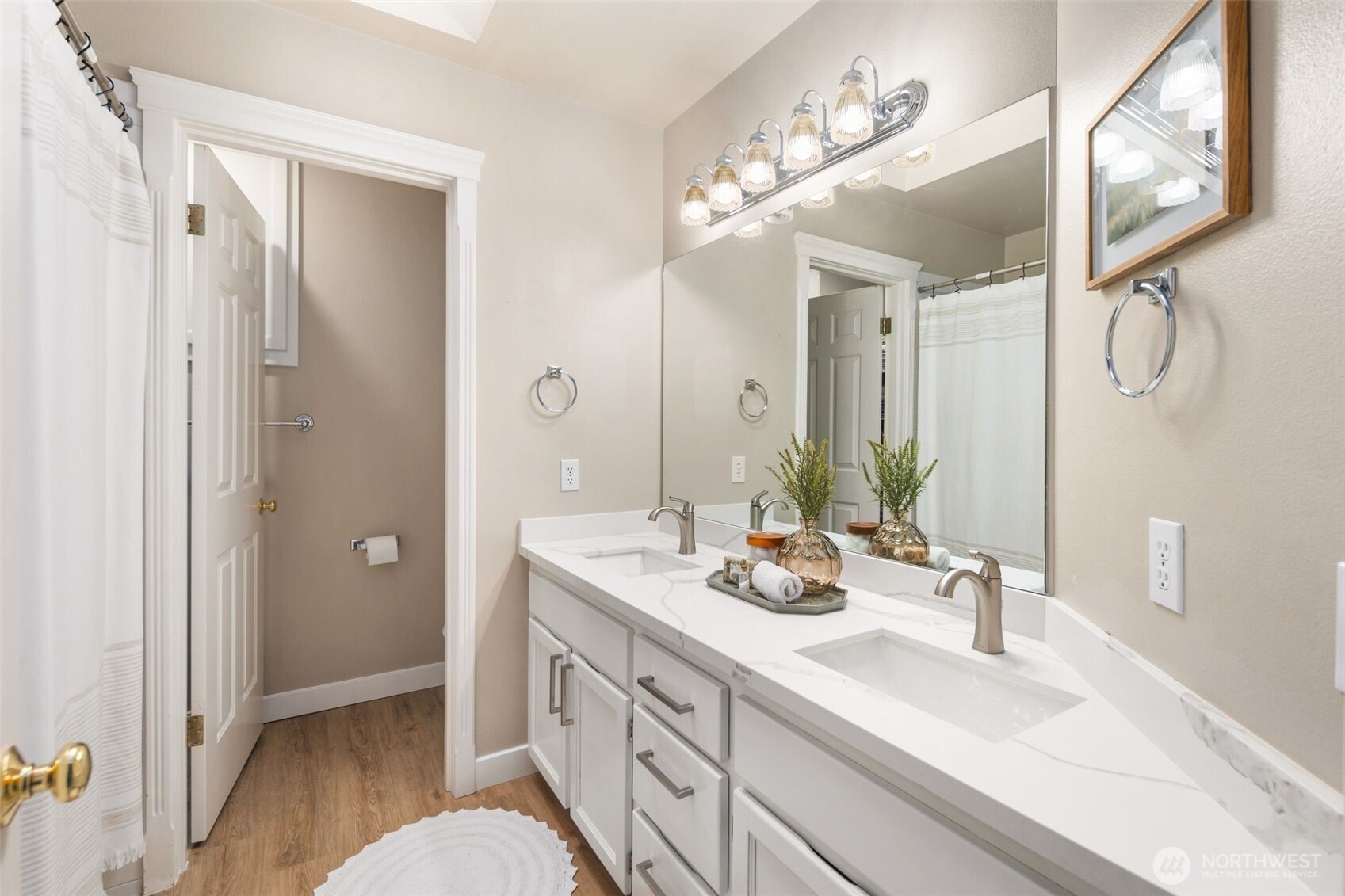 1514 232nd Place Southwest Bothell, WA 98021 - Photo 20 of 38 a spacious bathroom with a double vanity sink a large mirror and shower