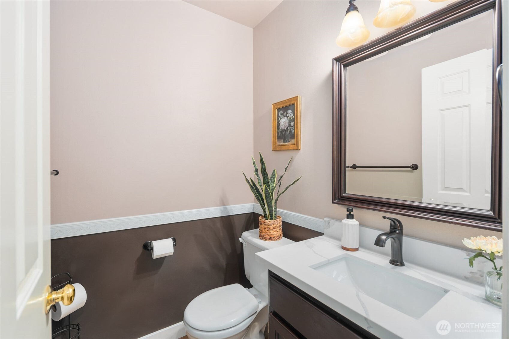 1514 232nd Place Southwest Bothell, WA 98021 - Photo 24 of 38 a bathroom with a sink a toilet and mirror