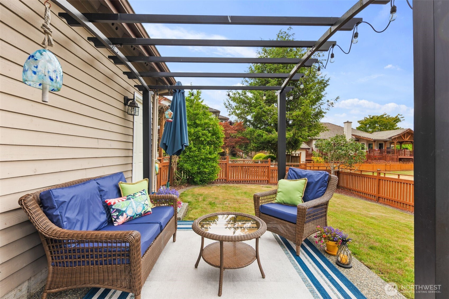 1514 232nd Place Southwest Bothell, WA 98021 - Photo 26 of 38 a outdoor living room with patio furniture and a potted plant