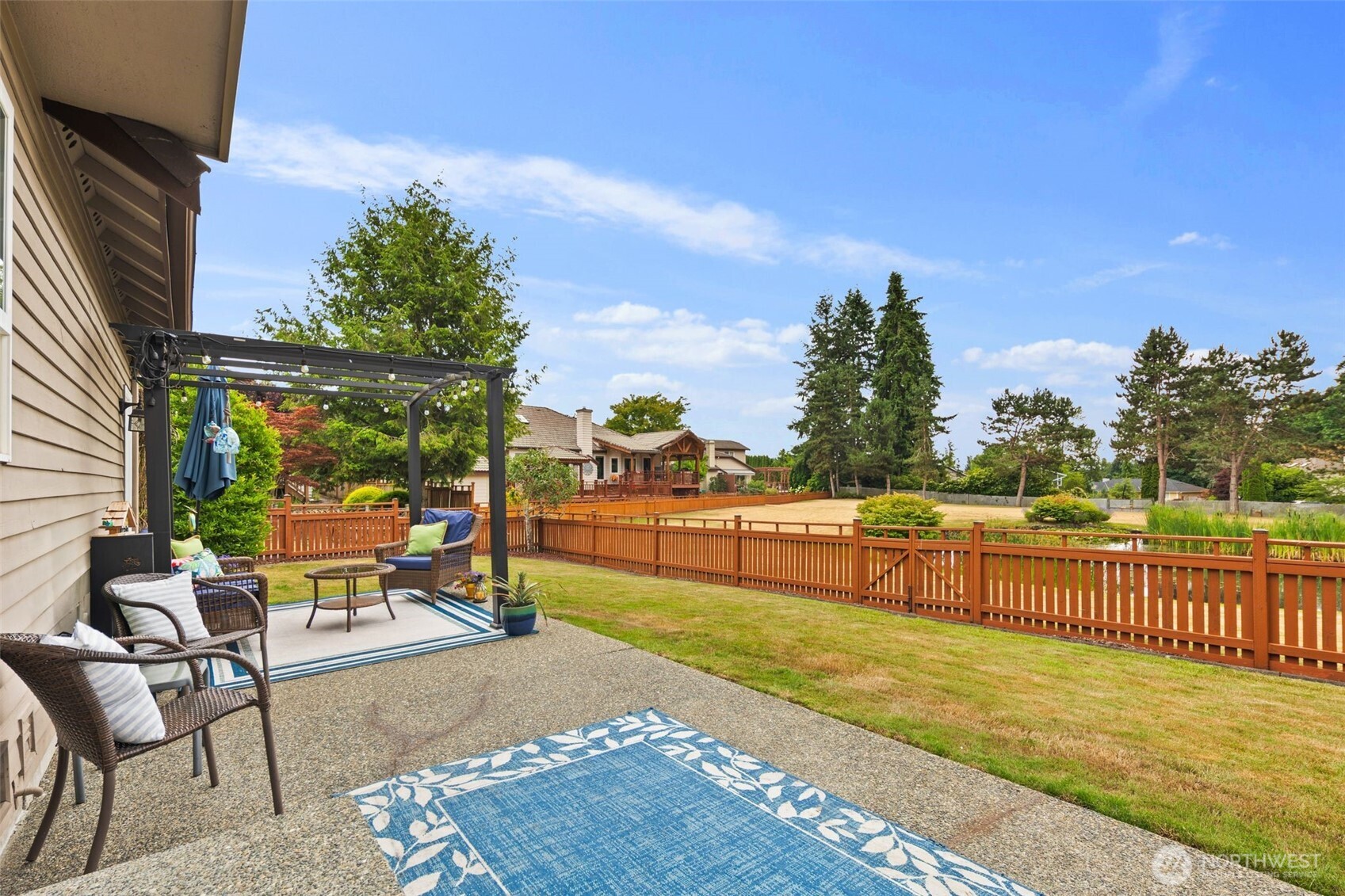 1514 232nd Place Southwest Bothell, WA 98021 - Photo 27 of 38 a view of a terrace with couches and wooden fence