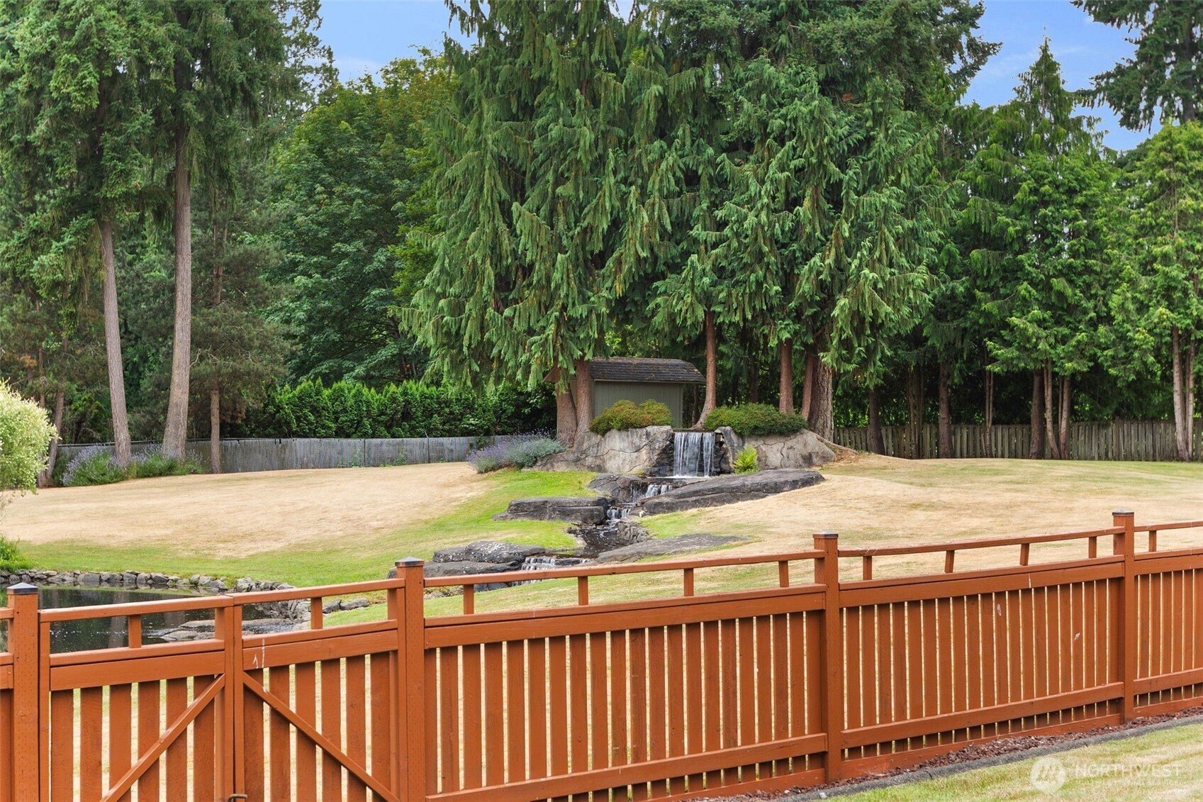 1514 232nd Place Southwest Bothell, WA 98021 - Photo 28 of 38 a view of a yard with wooden fence