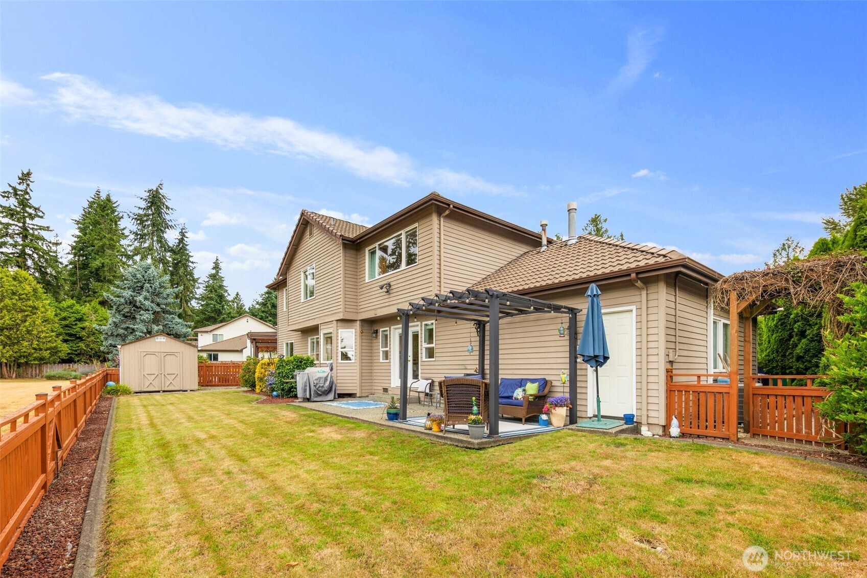 1514 232nd Place Southwest Bothell, WA 98021 - Photo 29 of 38 a view of a house with pool and chairs