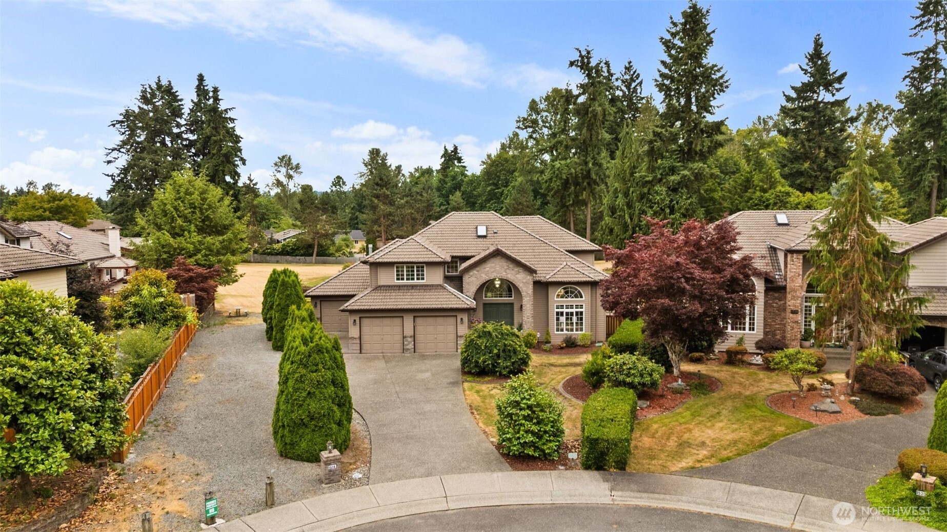 1514 232nd Place Southwest Bothell, WA 98021 - Photo 36 of 38 a front view of a house with garden