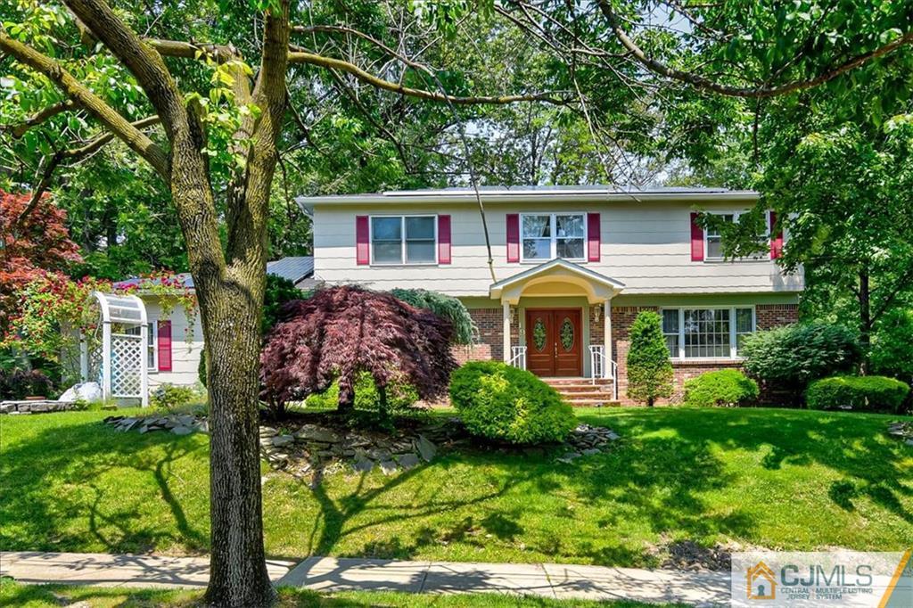 19 Thomas Road East Brunswick, NJ 08816 - Photo 2 of 37 a front view of house with a garden