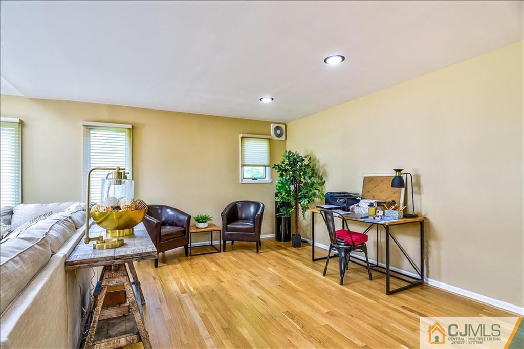 19 Thomas Road East Brunswick, NJ 08816 - Photo 12 of 37 a view of a livingroom with furniture and a potted plant
