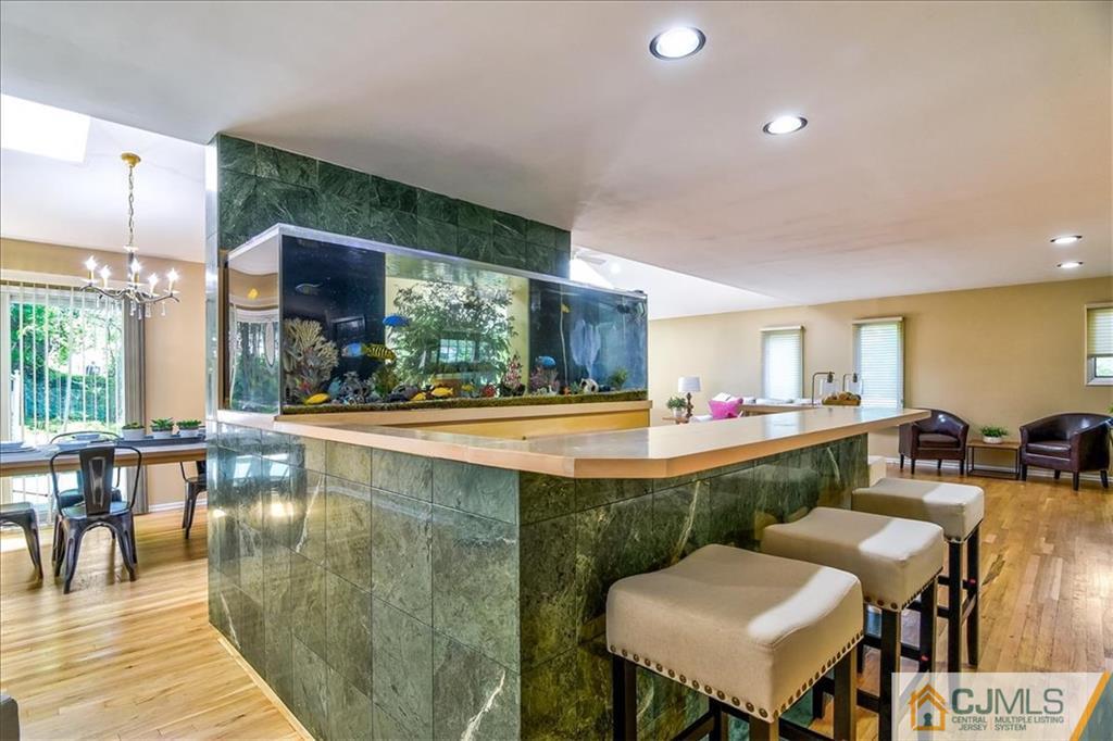 19 Thomas Road East Brunswick, NJ 08816 - Photo 13 of 37 a view of a dining room kitchen counter and chairs