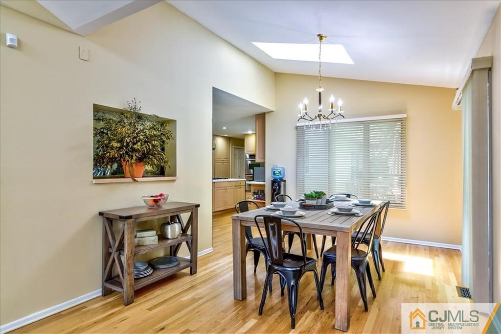 19 Thomas Road East Brunswick, NJ 08816 - Photo 19 of 37 a view of a dining room with furniture and wooden floor