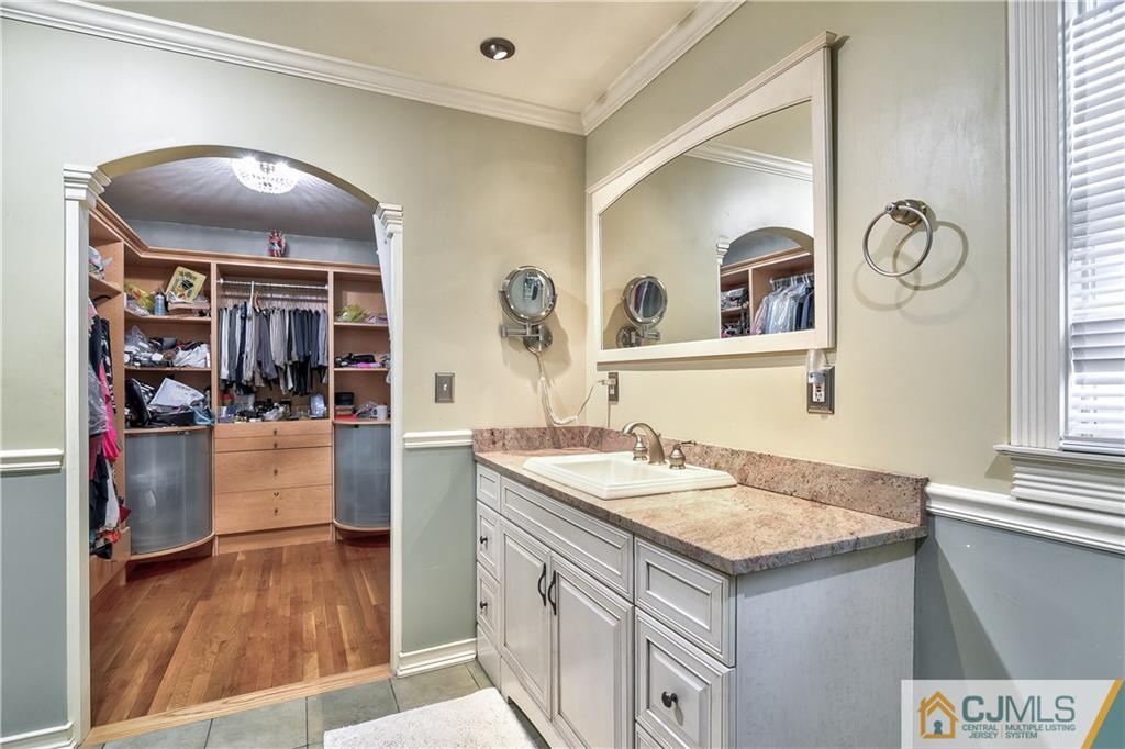 19 Thomas Road East Brunswick, NJ 08816 - Photo 26 of 37 a bathroom with a sink and a mirror