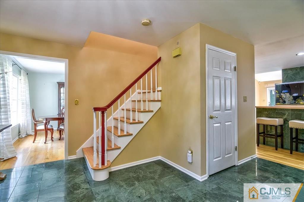 19 Thomas Road East Brunswick, NJ 08816 - Photo 4 of 37 a view of entryway and hall with wooden floor