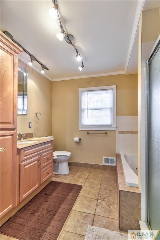 19 Thomas Road East Brunswick, NJ 08816 - Photo 31 of 37 a bathroom with a sink a toilet and a large mirror