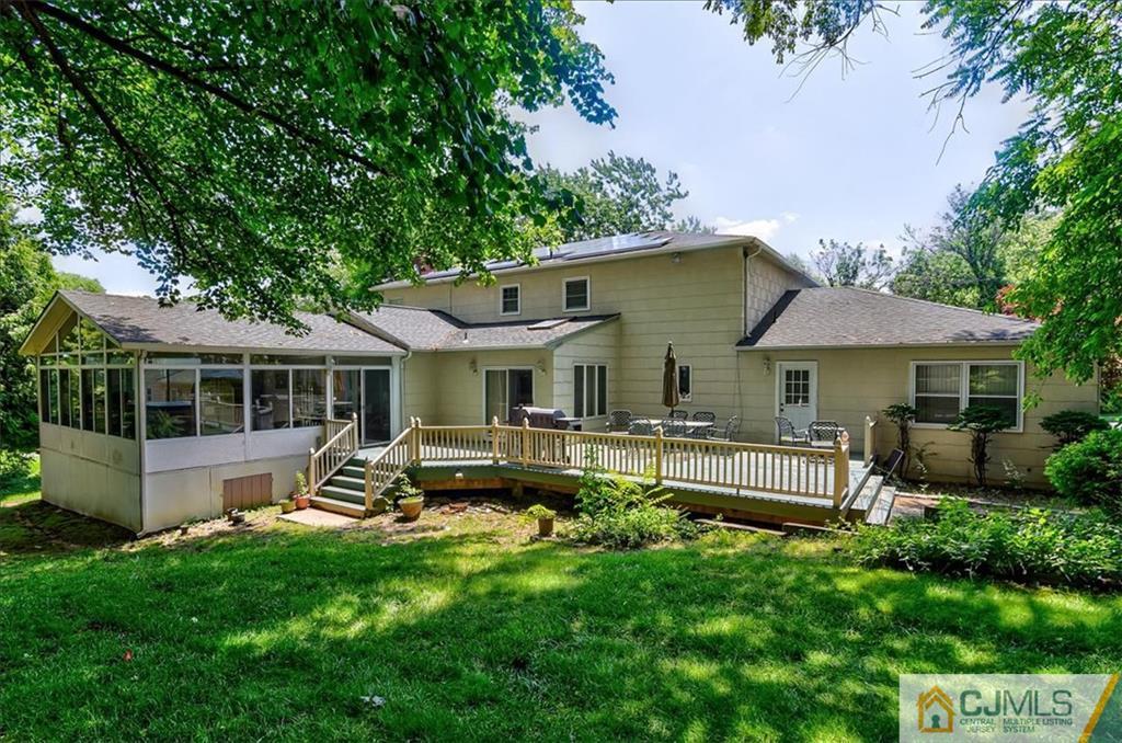 19 Thomas Road East Brunswick, NJ 08816 - Photo 36 of 37 a front view of house with a garden