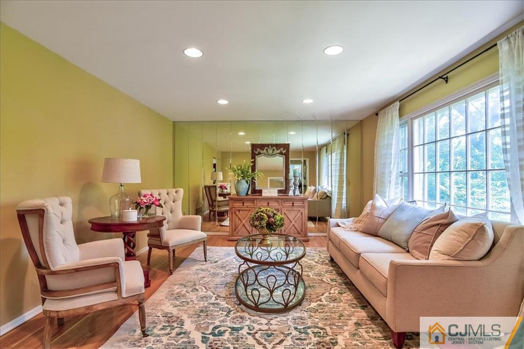 19 Thomas Road East Brunswick, NJ 08816 - Photo 5 of 37 a living room with furniture and a large window