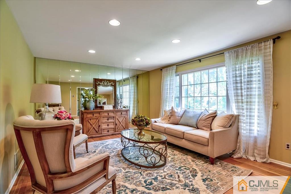 19 Thomas Road East Brunswick, NJ 08816 - Photo 6 of 37 a living room with furniture and a large window
