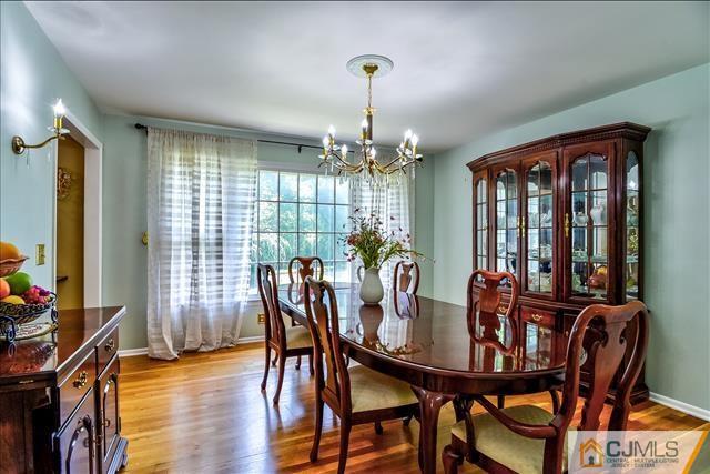 19 Thomas Road East Brunswick, NJ 08816 - Photo 8 of 37 a view of a dining room with furniture window and wooden floor