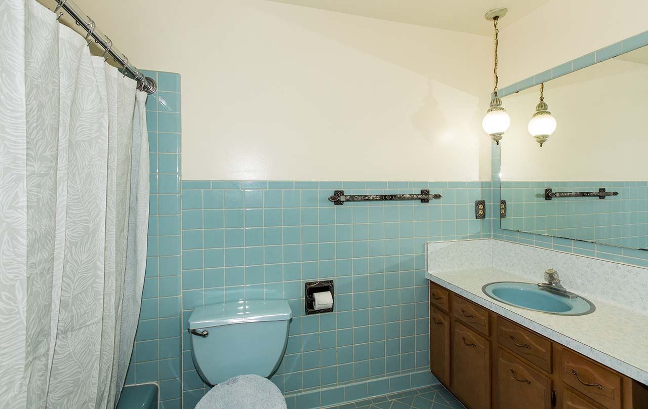 5221 Brookview Road Rockford, IL 61107 - Photo 16 of 25 a bathroom with a sink a toilet and shower